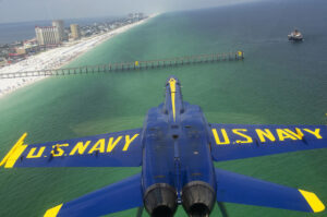 110707-N-BA418-065 PENSACOLA, Fla. (July 7, 2011) An F/A-18 Hornet assigned to the U.S. Navy flight demonstration squadron, the Blue Angels, flies inverted over Pensacola Beach while performing the double farvel maneuver during a practice flight demonstration. The Blue Angels are scheduled to perform in the 2011 Pensacola Beach Air Show July 9 in cooperation with the Centennial of Naval Aviation. (U.S. Navy photo by Mass Communication Specialist 3rd Class Andrew Johnson/Released)